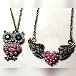 2 Necklesses a Owl & a Heart With Wings with Pink Pearl's in the Center.